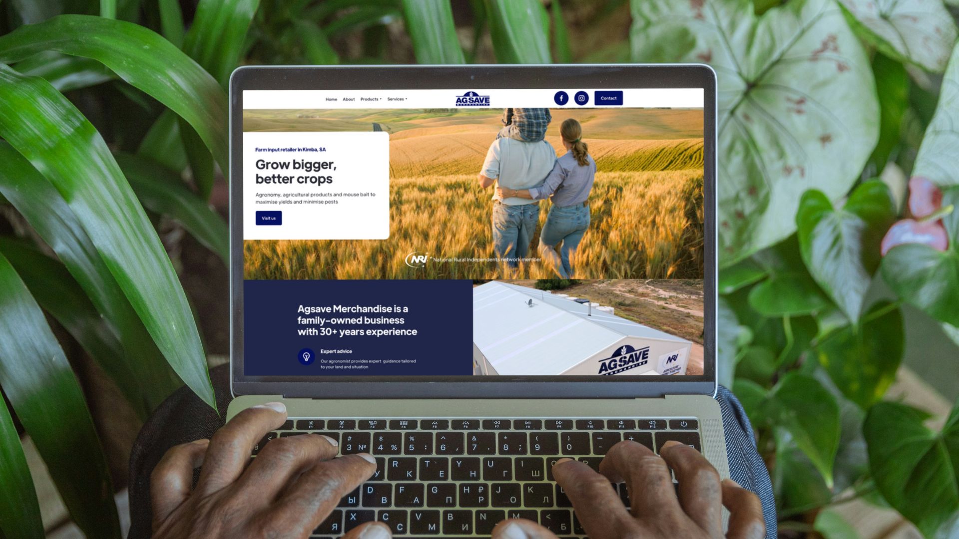Agsave Merchandise Kimba Website on a laptop with plants behind